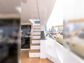 A sleek interior shot showcasing the elegant staircase of a luxury yacht, highlighting the modern design and craftsmanship that enhances the onboard experience.