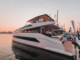 A stunning yacht docked at sunset, showcasing its sleek design and luxurious features — perfect for upscale boating experiences.
