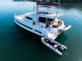 A stunning aerial view of a Bali 4.1 catamaran docked in calm waters, showcasing its sleek design and spacious layout, perfect for luxury sailing adventures.