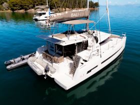 A stunning aerial view of a Bali 4.1 catamaran anchored in serene waters, showcasing its sleek design and spacious layout, perfect for luxurious sailing adventures.