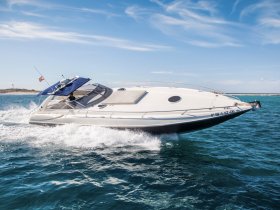 A sleek speedboat glides through clear waters, showcasing its dynamic design and performance — perfect for thrilling adventures on the sea.
