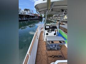 Interior view of a boat's helm and seating area, showcasing modern design and functionality, perfect for a day on the water.