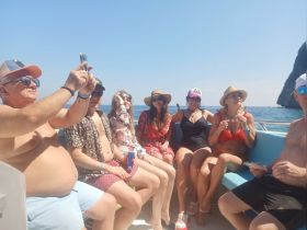 A lively group enjoys a fun day on the boat, capturing memories under the sun — perfect for celebrations and social gatherings on the water.