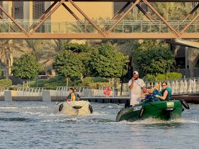 A lively scene featuring a group enjoying a boating experience, showcasing the fun of water activities in a vibrant setting.
