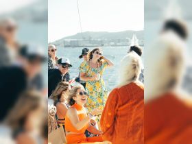 A lively group enjoys a festive atmosphere aboard a boat, celebrating with drinks and laughter — perfect for memorable gatherings on the water.