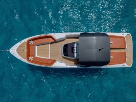 A stunning aerial view of a sleek yacht showcasing its elegant design and spacious deck, perfect for luxury outings on the water.