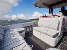 A stylish interior view of a Midnight Express boat showcasing comfortable seating and helm area, perfect for a day on the water.