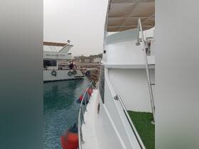 A view of two boats docked at a harbor, showcasing their structure and surroundings — ideal for exploring local marine adventures.