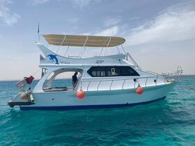 A sleek yacht glides through crystal-clear waters, showcasing its elegant design and inviting atmosphere for a perfect day on the sea.