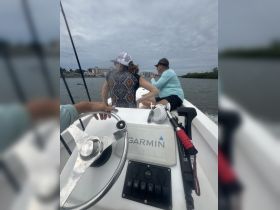 Guests enjoy a day on the water, taking in the scenery while aboard a boat — perfect for fishing or leisurely cruises.