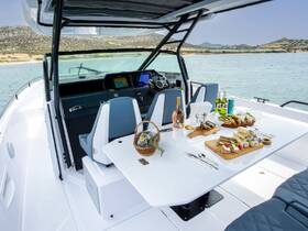 An elegant dining setup on a boat featuring a selection of gourmet food and drinks, perfect for a luxurious day on the water.