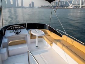 A spacious helm area featuring comfortable seating and a well-equipped console, perfect for navigating the waters in style.