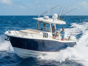 A group of fishermen enjoy a day on the water aboard a Belzona boat, showcasing the thrill of ocean fishing and adventure.