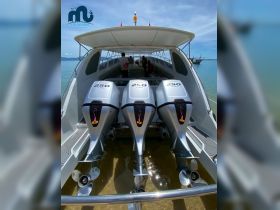 An interior view of a boat showcasing powerful Honda engines, with guests onboard enjoying the spacious cabin area — perfect for group excursions on the water.