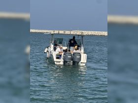 A group enjoys a day out on the water aboard a boat, showcasing the fun and camaraderie of on-water activities.