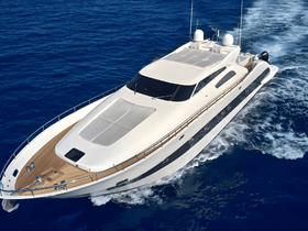 A stunning aerial view of a luxurious yacht cruising through deep blue waters, showcasing its elegant design and spacious deck — perfect for upscale charters and private getaways.