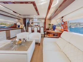 A beautifully designed interior of a yacht featuring elegant seating and dining areas, perfect for luxurious cruising experiences.