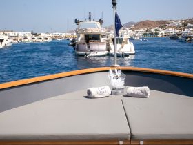 A stylish setup featuring chilled drinks and plush towels on the deck, perfect for a luxurious day on the water.
