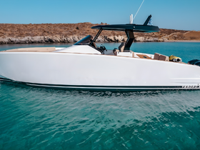 A sleek yacht glides through crystal-clear waters, showcasing its elegant design and perfect for luxury outings.