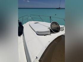 A view from the front deck of a yacht, showcasing the serene turquoise waters and a swimmer in the distance — perfect for relaxing days on the water.