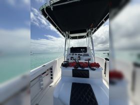 Interior view of a boat's helm featuring seating and snorkeling gear, perfect for adventure seekers ready to explore the waters.