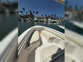 Interior view of a boat's seating area, showcasing comfortable lounge spaces ideal for relaxing on the water.