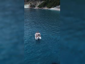 A group enjoys a leisurely day on a boat in crystal-clear waters, perfect for relaxation and adventure on the open sea.