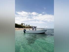 A sleek speedboat named 'Poseidon' anchored in crystal-clear waters, surrounded by a picturesque shoreline and palm trees, perfect for a day of adventure on the water.