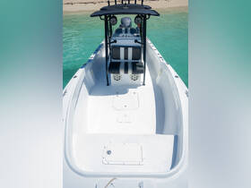 Interior view of a sleek boat helm featuring comfortable seating and modern controls, perfect for a day on the water.
