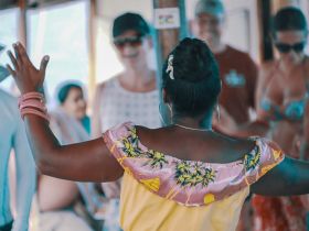 A lively scene aboard a boat where guests are enjoying a celebration, showcasing the fun and camaraderie of a boat party.