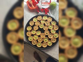 A delicious spread of savory snacks displayed on a tray, perfect for onboard catering during a boat trip or gathering.