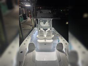 A sleek interior view of a well-appointed boat helm and seating area, showcasing modern design and comfort for an enjoyable boating experience.