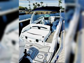 A sleek interior view of a Four Winns boat showcasing comfortable seating and a modern helm, perfect for a day on the water.