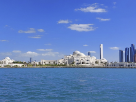 A stunning view of iconic architecture along the coastline, showcasing the beautiful skyline and clear blue waters — perfect for sightseeing and exploring the vibrant culture.