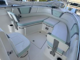 Interior view of a boat's seating area, showcasing comfortable lounge space ideal for relaxation while on the water.