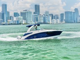 A sleek speedboat navigates the vibrant waters of Miami, with a stunning city skyline in the background, perfect for showcasing luxury boating experiences.