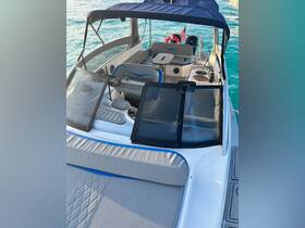 A well-appointed interior view of a boat's helm and seating area, showcasing comfortable spaces for relaxation and navigation on the water.