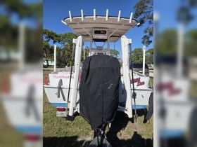 A rear view of a boat named 'Giddy Lee,' showcasing its structure and features, ideal for fishing or leisure activities on the water.