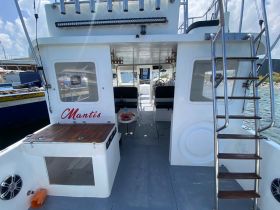 Interior view of the Mantis boat showcasing its spacious cabin and seating area, perfect for comfortable outings on the water.