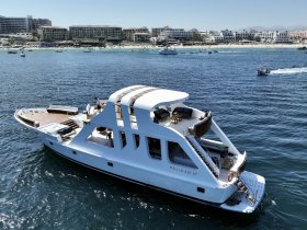 A stunning yacht named 'Pelican 17' is docked in clear waters, showcasing its elegant design and spacious deck, perfect for luxurious outings.