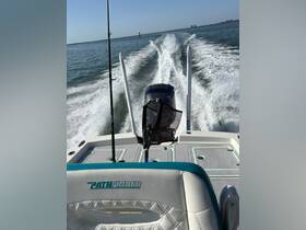 A sleek Pathfinder boat is captured in motion, showcasing its powerful engine and stylish design as it cuts through the water.
