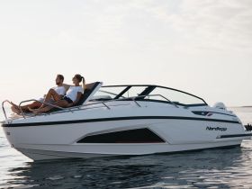 A couple enjoys a relaxing moment on the deck of a sleek boat, perfect for sunset cruises and romantic getaways on the water.