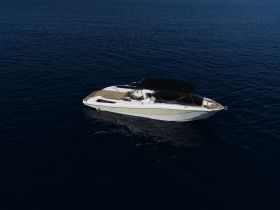 Aerial view of a sleek speedboat cruising through deep blue waters, perfect for thrilling adventures on the open sea.