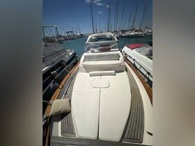 A spacious and inviting interior view of a boat's helm and seating area, perfect for relaxing and enjoying time on the water.