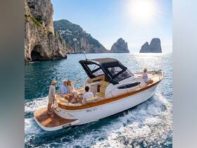 A group enjoys a scenic boat ride along the stunning coastline, highlighting the beauty of the landscape and the joy of shared experiences on the water.