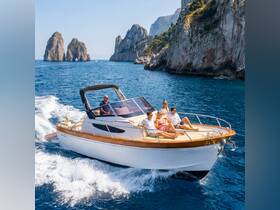 A group enjoys a scenic boat ride along the stunning coastline, capturing the essence of a perfect day on the water.