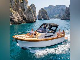 A group enjoys a scenic boat ride through stunning coastal rock formations, perfect for exploring beautiful destinations on the water.