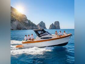 A lively group enjoys a sunny day on a boat, cruising along a stunning coastline — perfect for memorable outings and celebrations on the water.