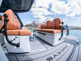 Interior view of a sleek boat featuring comfortable seating and a modern helm, perfect for enjoying a day on the water.