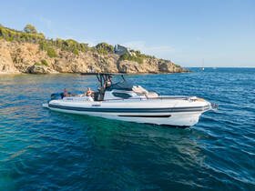 Two individuals enjoy a relaxing day on a sleek boat in clear blue waters, surrounded by scenic coastal views — perfect for summer adventures.
